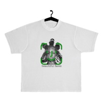 a white t - shirt with an image of a man in green