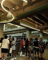 a group of people standing in a large indoor space